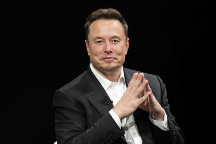 Man in suit clasping hands against black background