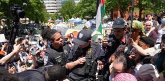 Police officers interacting with a crowd during a protest