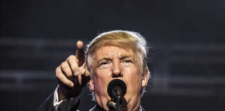 Donald Trump speaking passionately at a rally