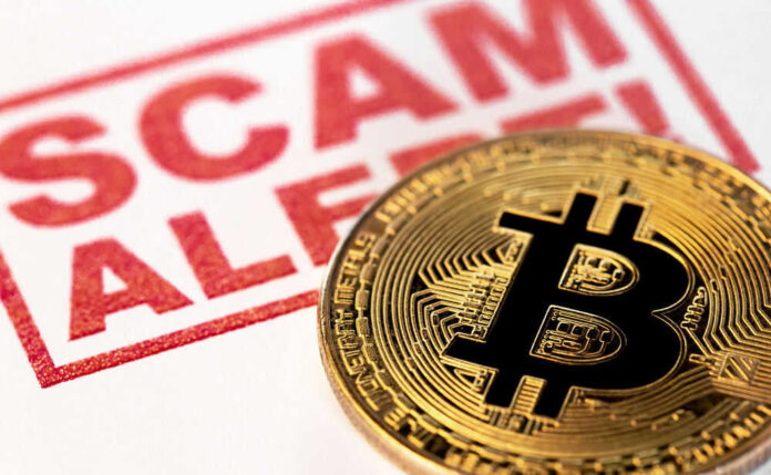 Bitcoin coin beside scam alert sign