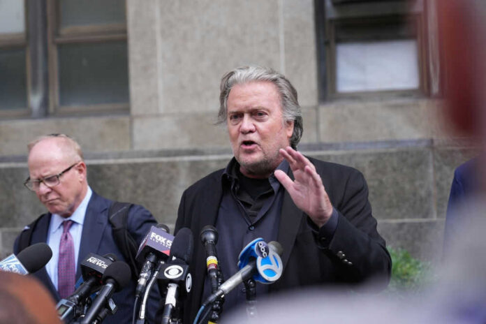 Man speaking at press conference in front of microphones