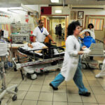 Busy hospital scene with medical staff and patients