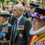 People in ceremonial military attire during outdoor event