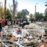 Rescue workers clearing debris after building collapse