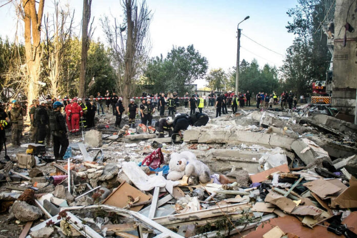 Rescue workers clearing debris after building collapse