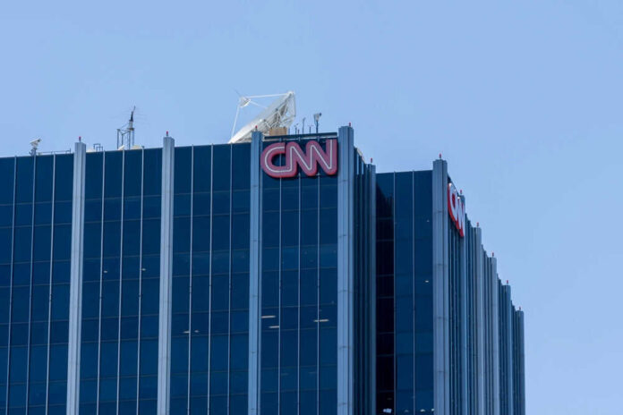 Glass building with CNN logo on rooftop