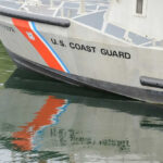 Coast Guard boat with reflection in water