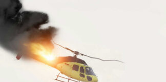 Helicopter on fire with smoke in the sky